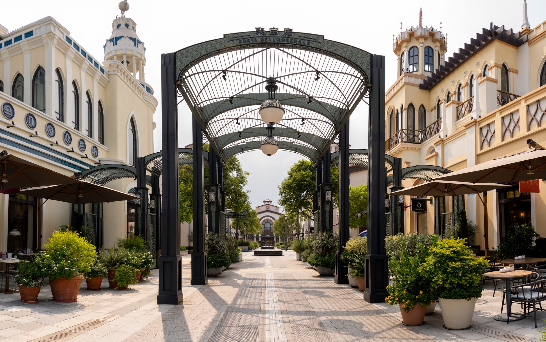 Shoppers walk through a European retail district as May trade data point to resilient euro area consumer demand.