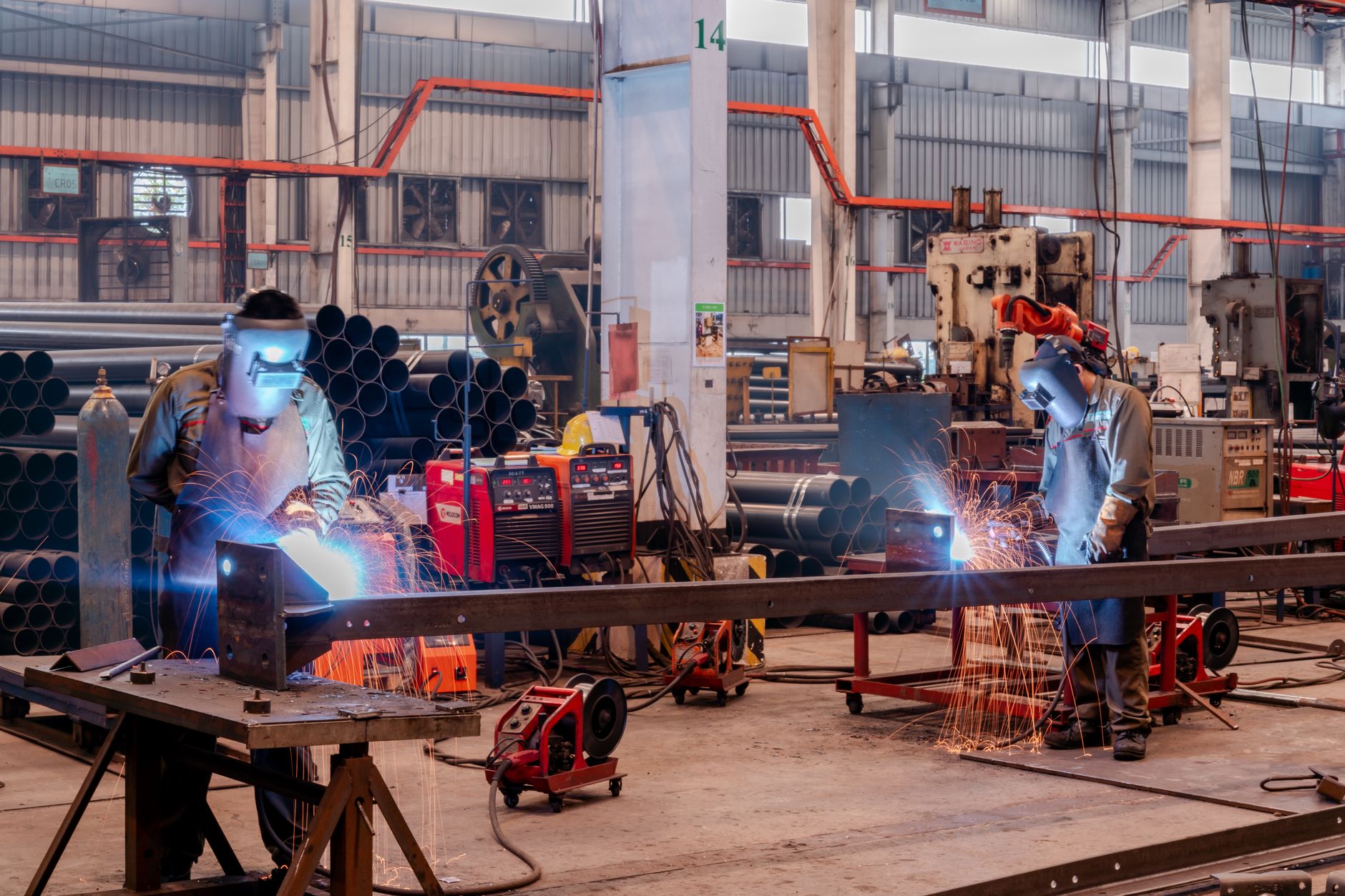 Autoliv safety components move through an automotive production facility as the company reports second-quarter earnings and a weaker global vehicle-output outlook.