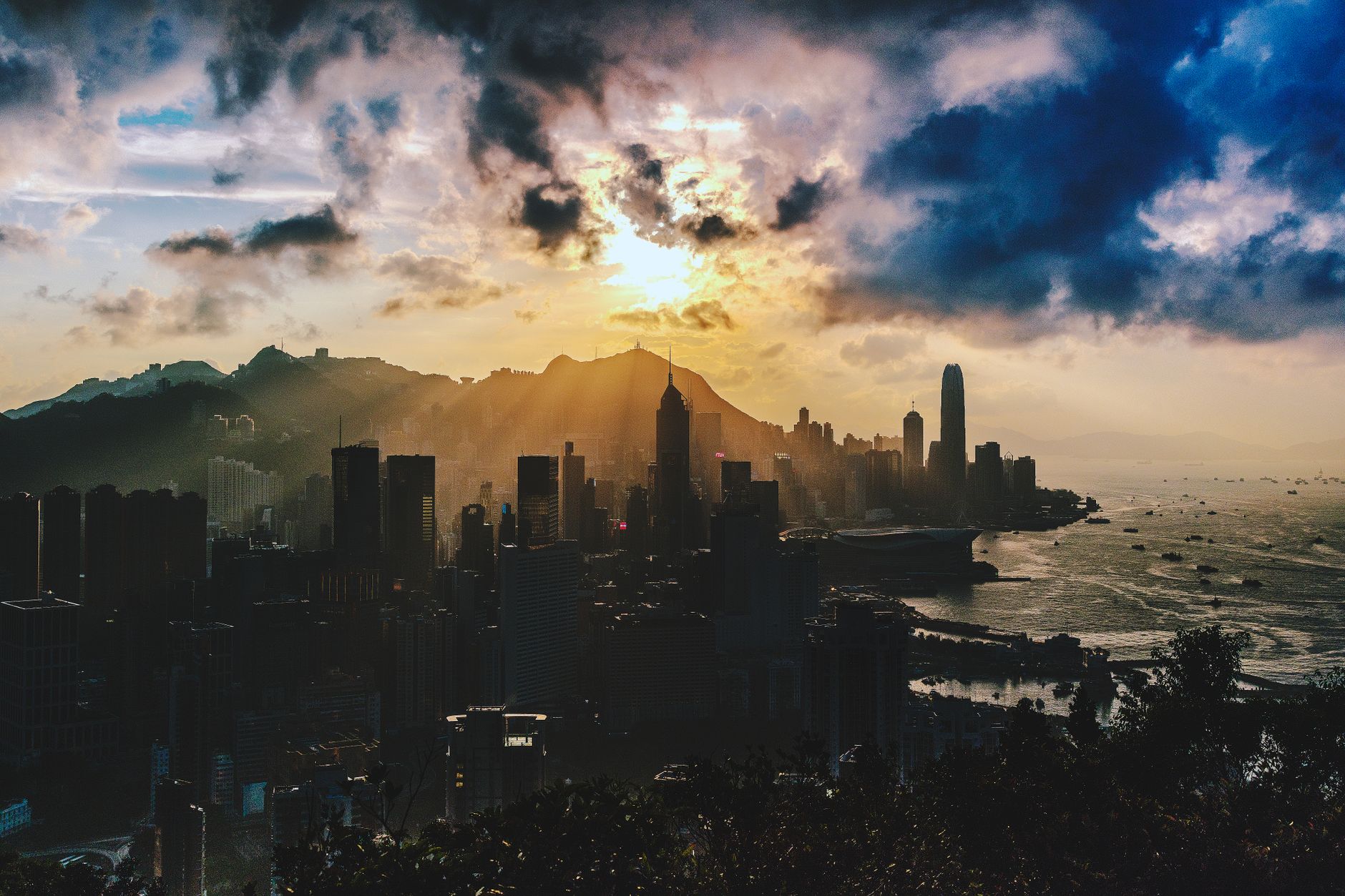 A Shein logo appears against Hong Kong’s financial district as the retailer advances toward a long-delayed stock market listing.