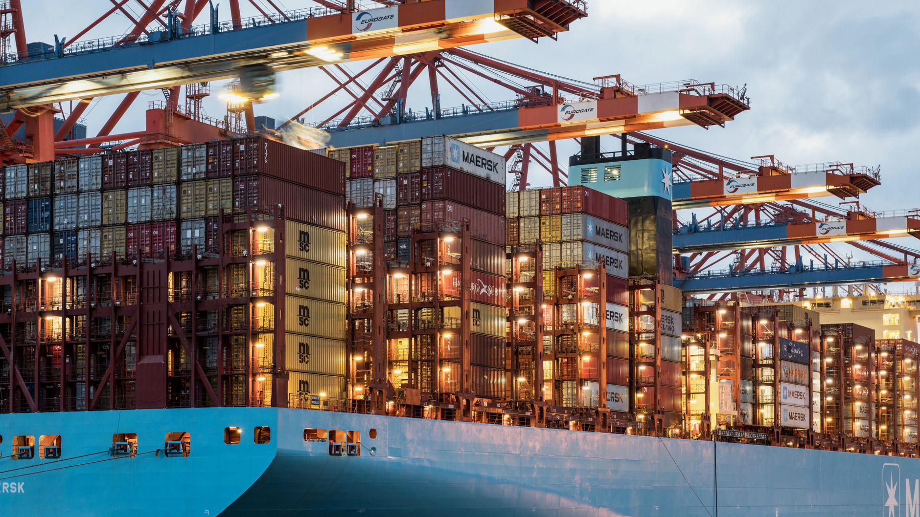 Containers and high-tech export cargo are handled at a major Chinese port as the country reports strong July trade growth.