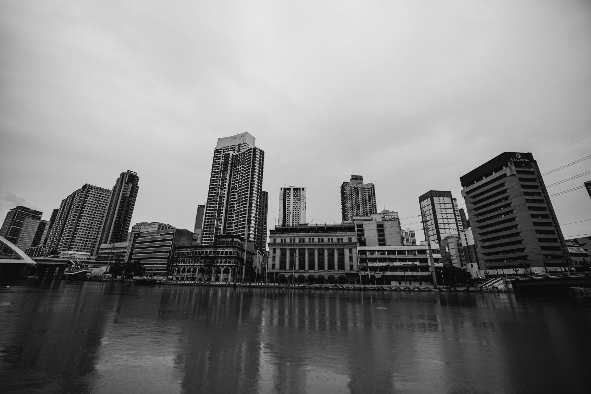 Manila’s commercial skyline illustrates the Philippine economy’s slowdown to 2.3% growth in the second quarter of 2026.