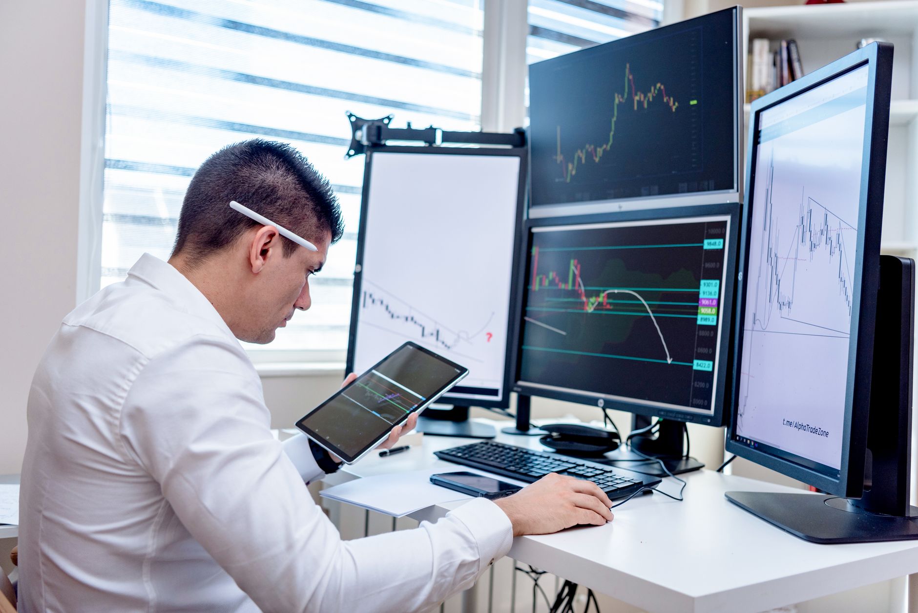 Institutional traders monitor automated European ETF orders and market data on electronic trading screens.