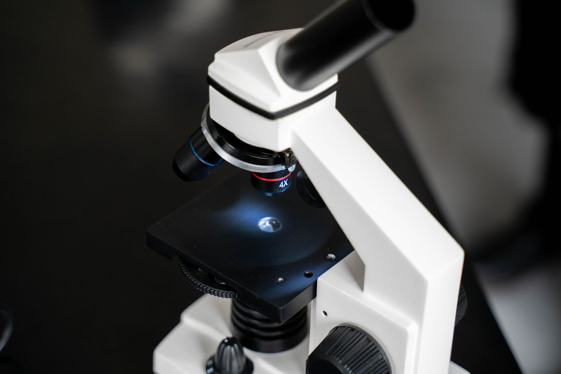 Scientists examine laboratory equipment while investors review Agilent Technologies earnings signals on market recovery.