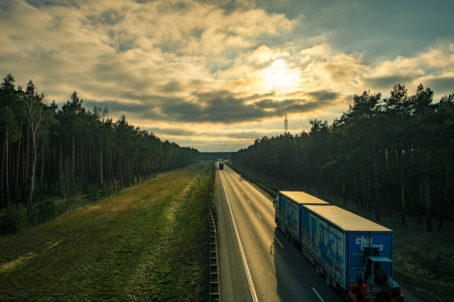 A PlusAI-equipped autonomous commercial truck operates on a highway as the company prepares for a targeted 2027 factory-built Level 4 launch.