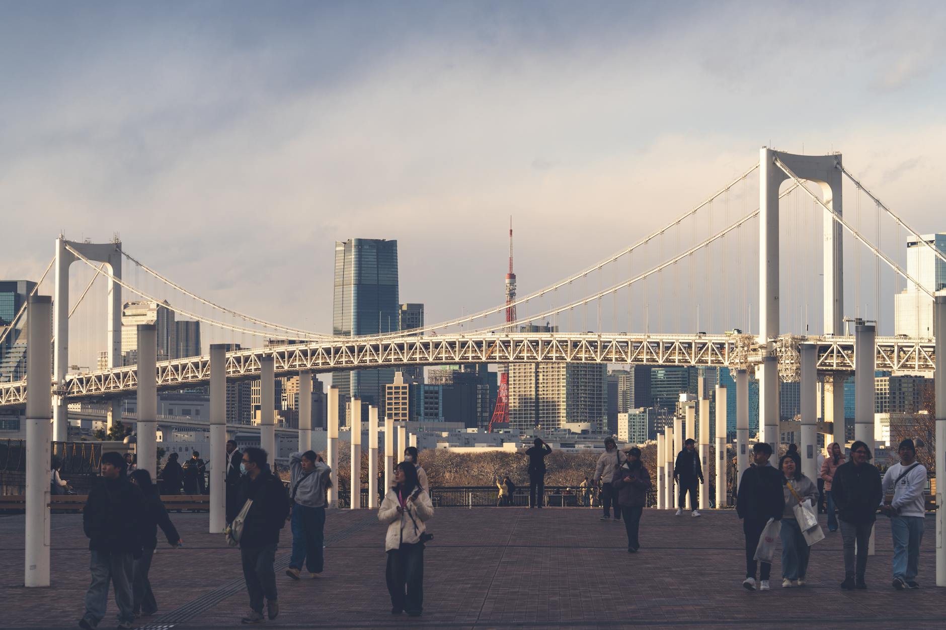 A cargo ship and containers at a Tokyo port illustrate Japan’s export-driven support for first-quarter economic growth.