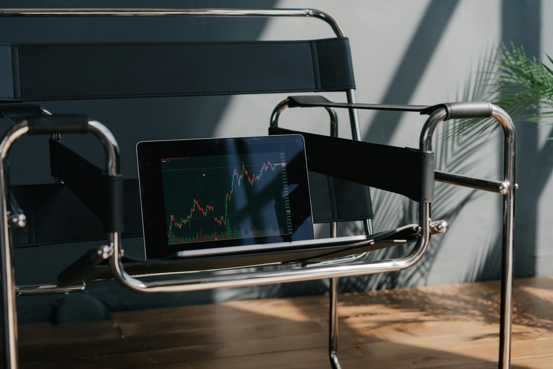 A financial adviser reviews AI-powered wealth-management insights with a client in a modern office setting.