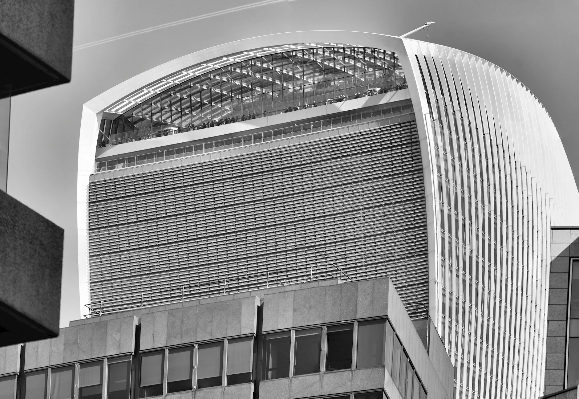 Investors and fund executives discuss a tender offer for a UK-listed investment trust in a London financial district setting.