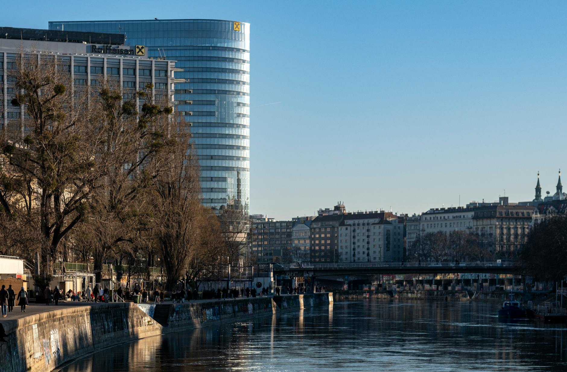 A European banking team reviews corporate loan pricing and capital allocation data in a modern office setting.