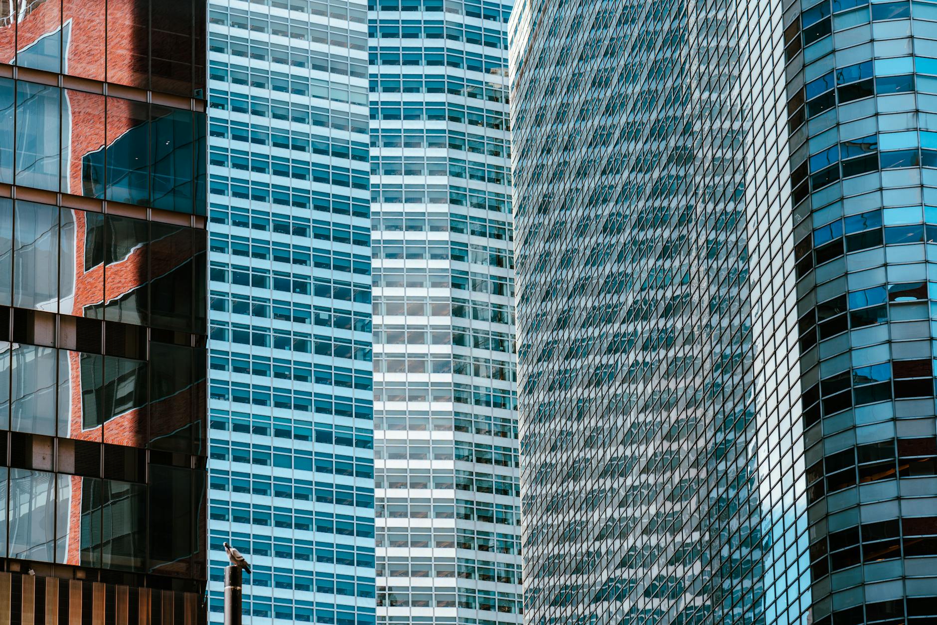 Financial professionals monitor digital trading infrastructure screens during a blockchain-based securities settlement discussion on Wall Street.