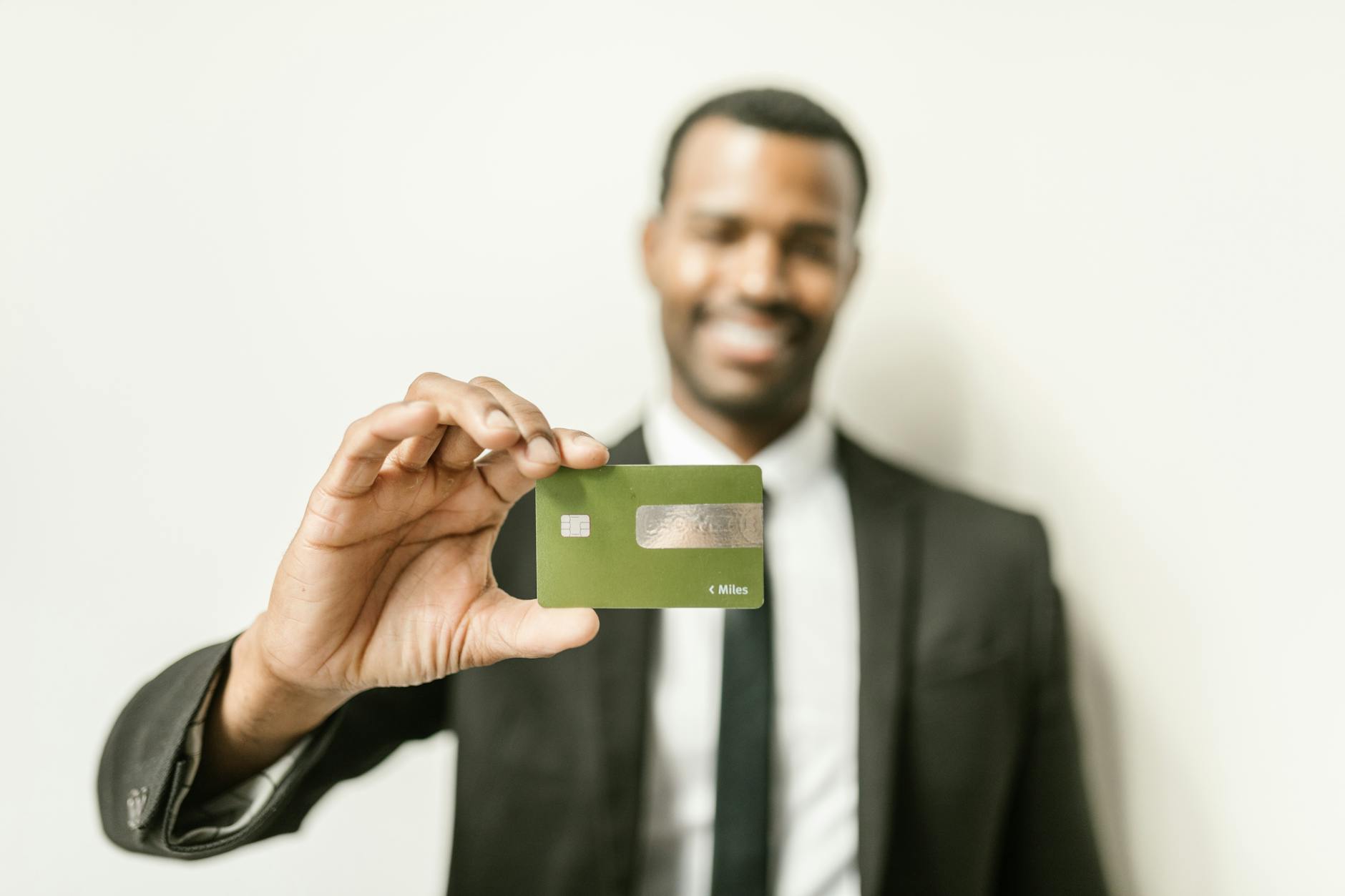 A crypto-enabled debit card is shown beside a mobile payments app during a fintech discussion on global digital payments.