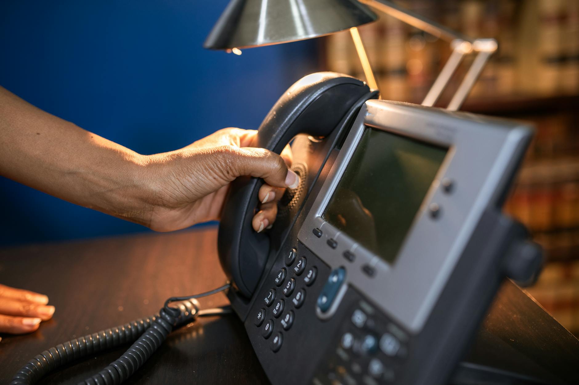 Business telecom executives review market data as Gamma Communications faces takeover interest from multiple potential buyers.