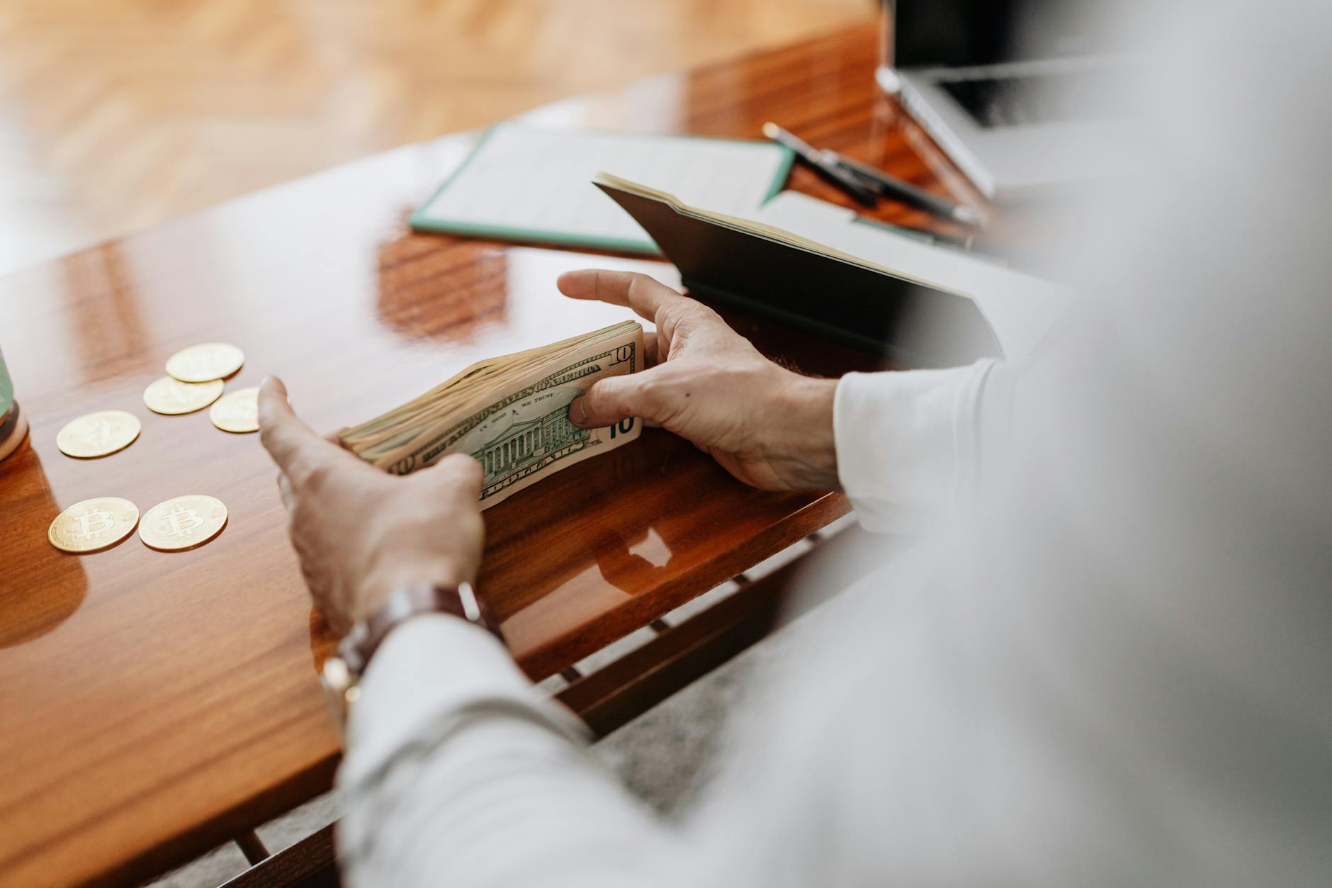 A financial advisor speaks with affluent clients in a modern wealth management office.