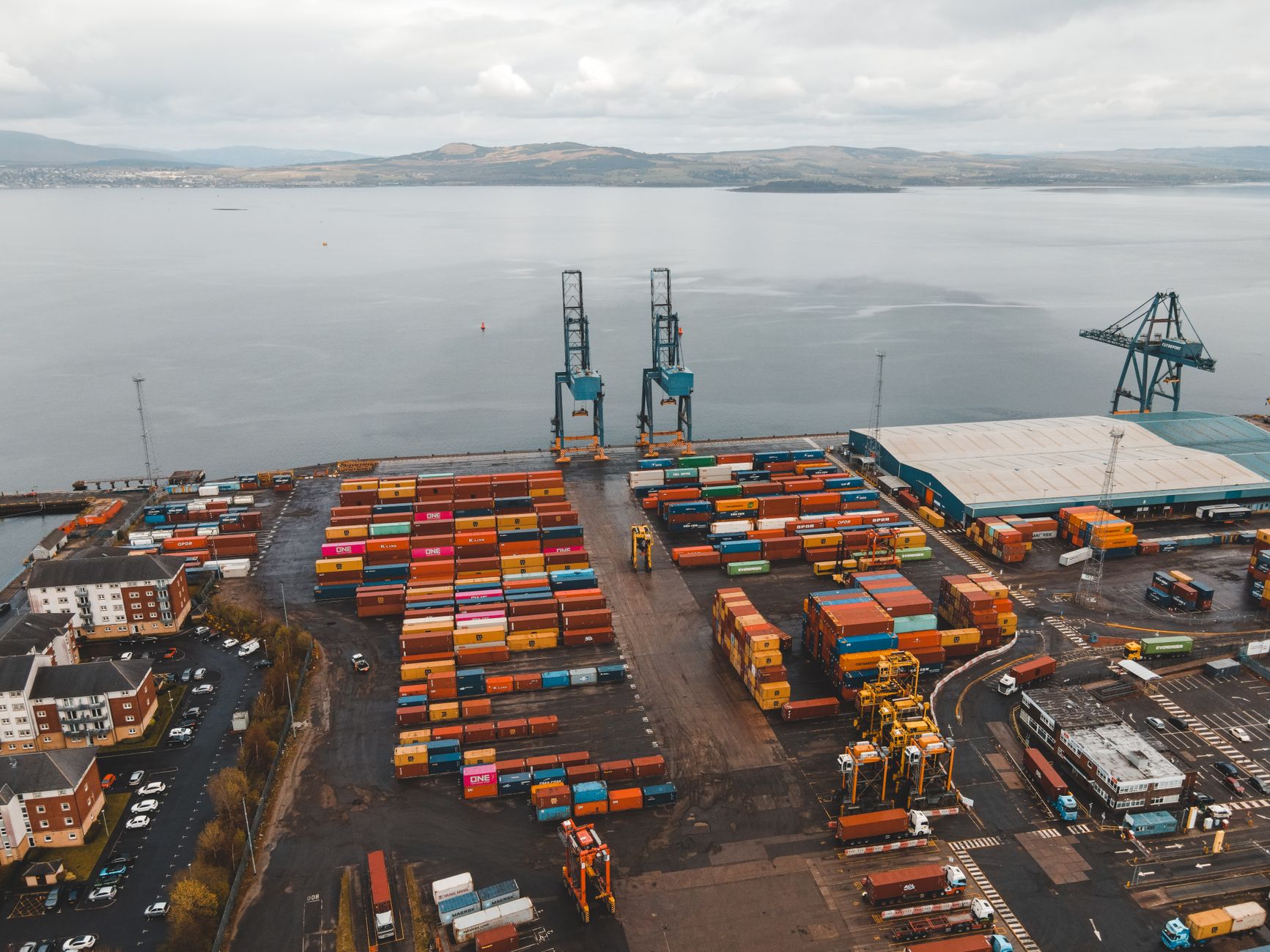 Cargo containers at a U.S. port illustrate new Section 301 tariffs imposed over forced-labor import enforcement.