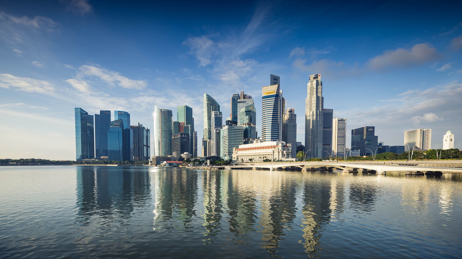 Singapore’s skyline and financial district illustrate the central bank’s surprise decision to tighten exchange-rate policy for a second consecutive quarter.