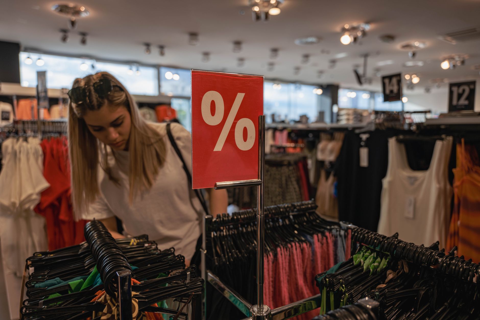 Customers shop inside a discount retail store as TJX Companies reports quarterly earnings highlighting resilient value-focused consumer demand.