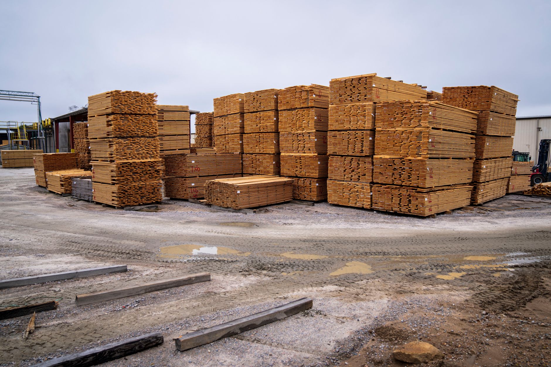 Stacks of recycled synthetic lumber inside a Tangent Technologies manufacturing and distribution facility.