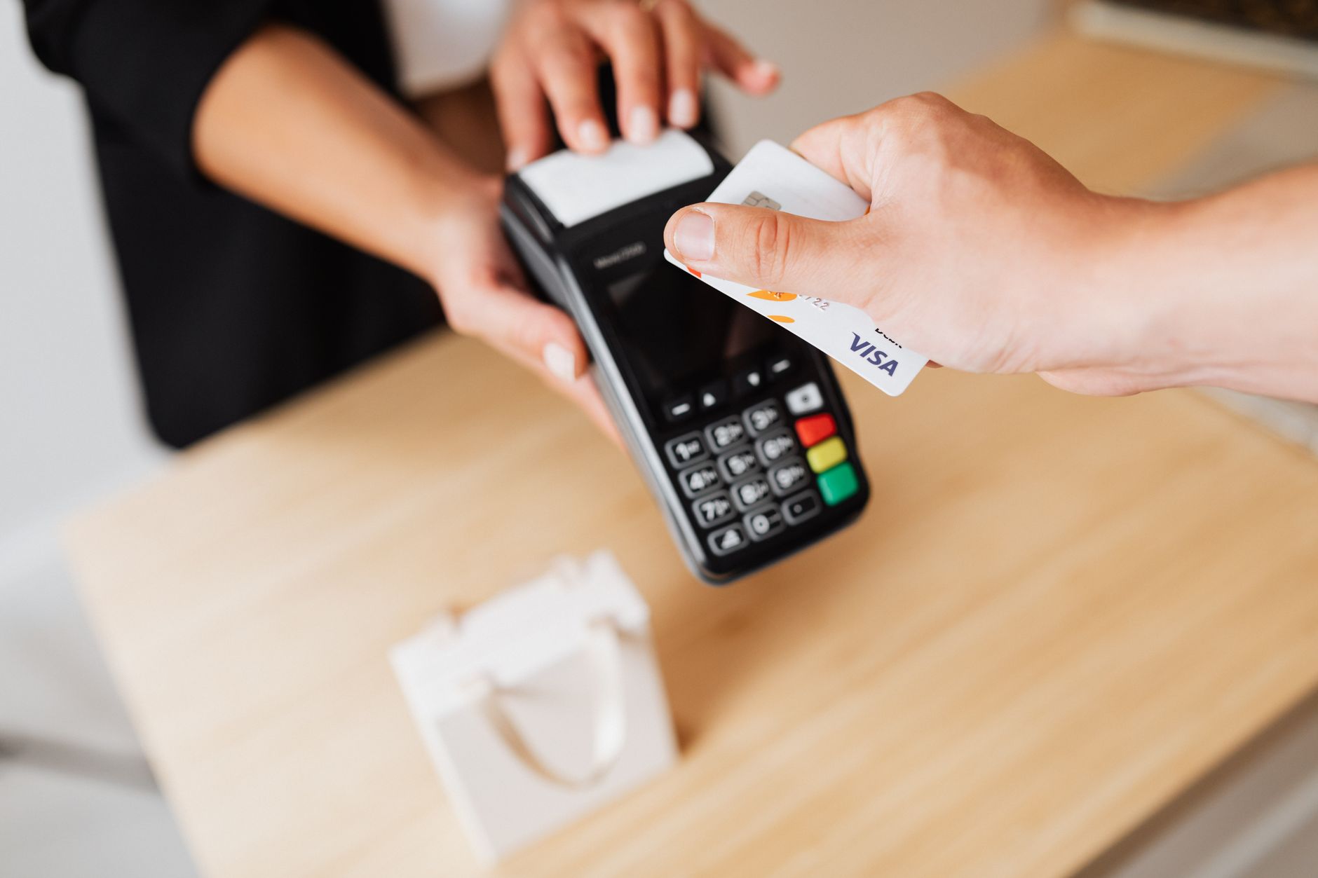 A shopper uses an AI assistant to explore retail financing, rewards and payment offers through a digital commerce interface.