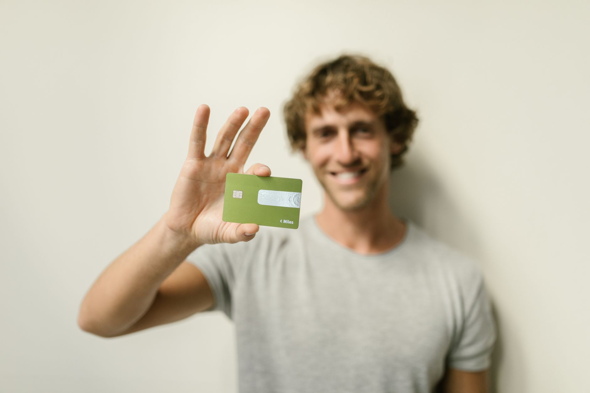 A digital banking customer using a stock reward card product that connects payments with investment benefits at a fintech launch event.