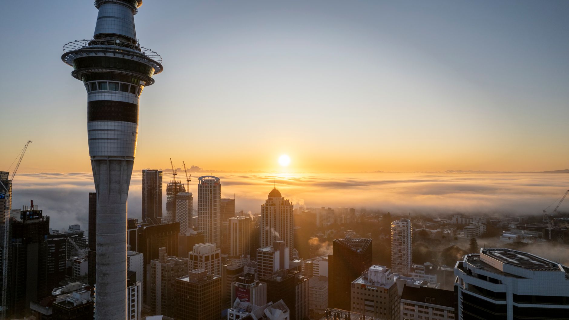 Wellington’s skyline and construction activity illustrate New Zealand’s modest economic expansion in the June 2026 quarter.