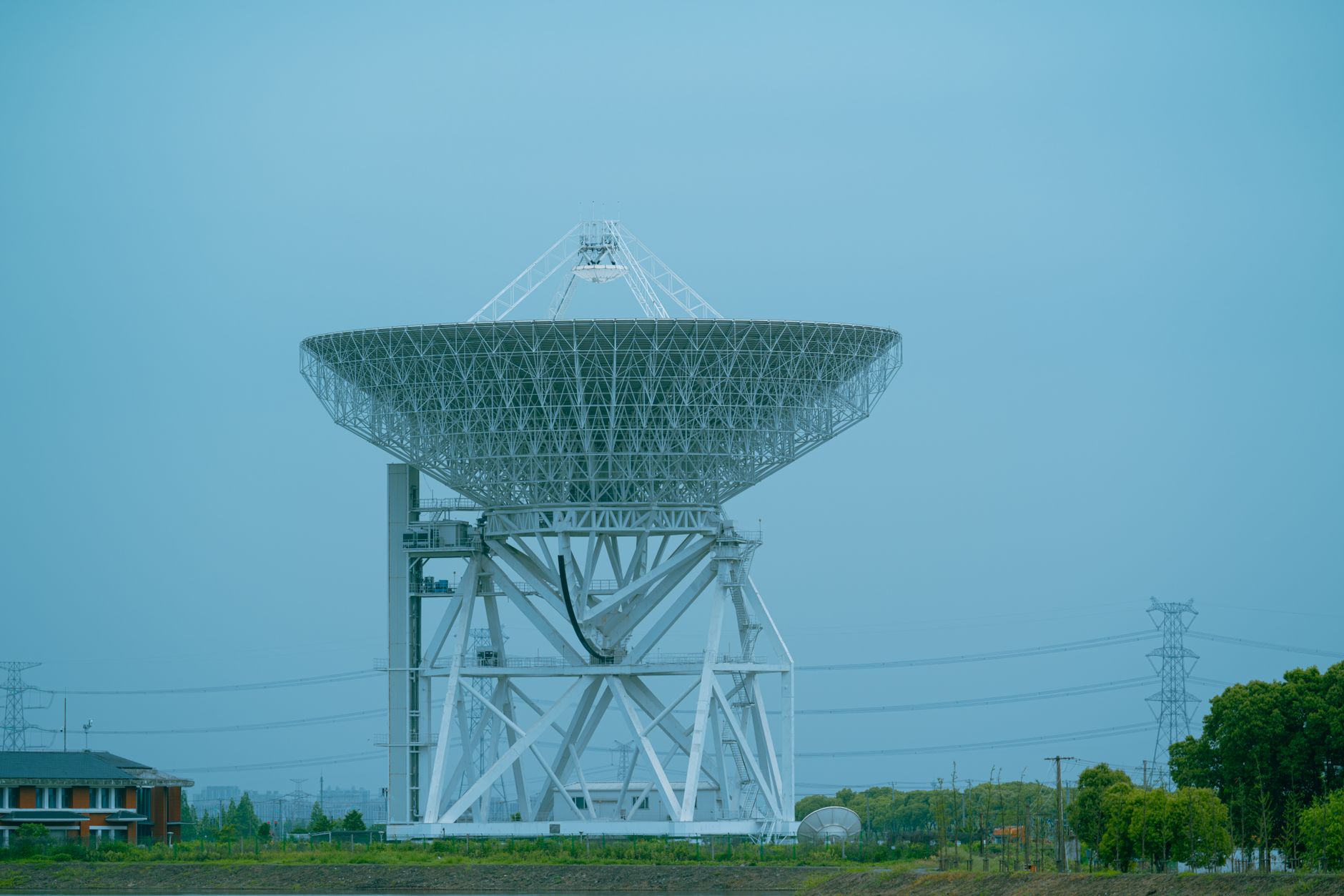 SpaceX Starlink satellites and telecommunications infrastructure illustrating the changing competition in global wireless connectivity.